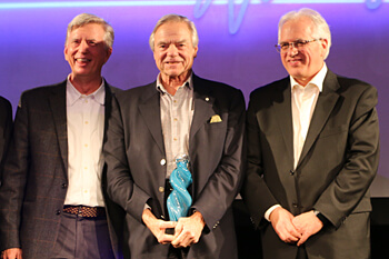 winner accepting an award on stage