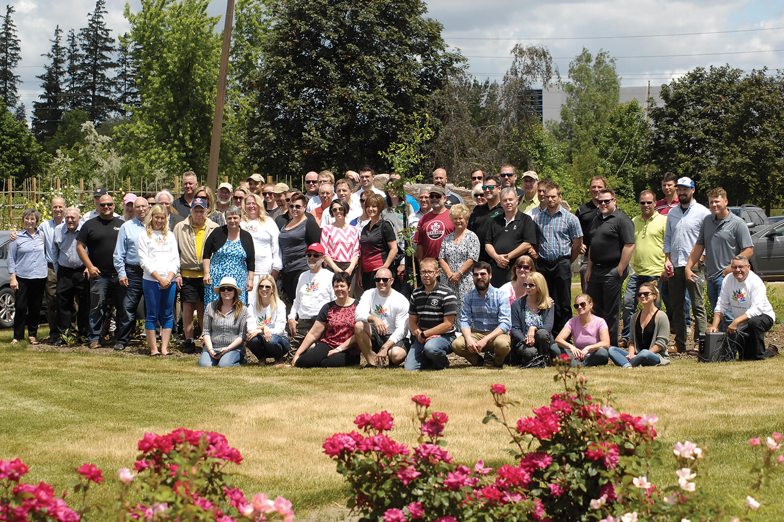 A newly-planted Vimy Oak from Connon NVK is surrounded by visitors at LO's Milton property.