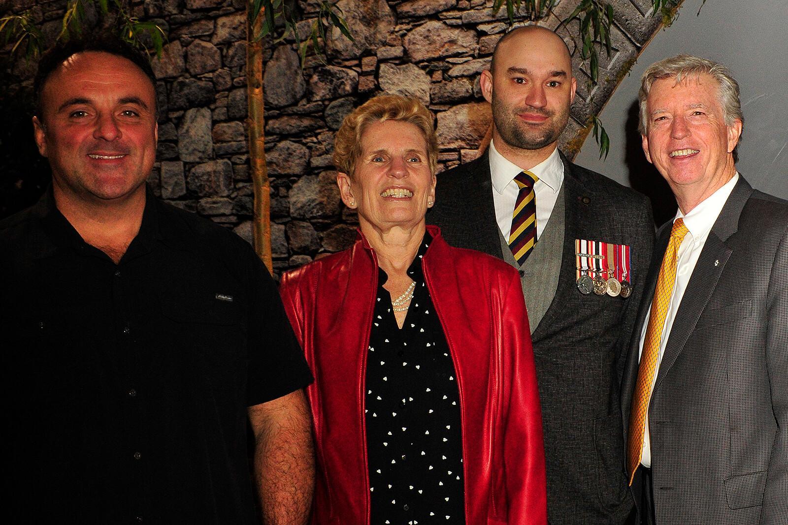 Canada Blooms began with an event in the Highway of Heroes Living Tribute garden where Ontario Premier, Kathleen Wynne (centre) announced the province will contribute $1 million to the HOHLT campaign. Wynne is pictured with garden builder, Joe Genovese (left), volunteer fundraiser, Cpl. Nick Kerr, and founder, Mark Cullen.