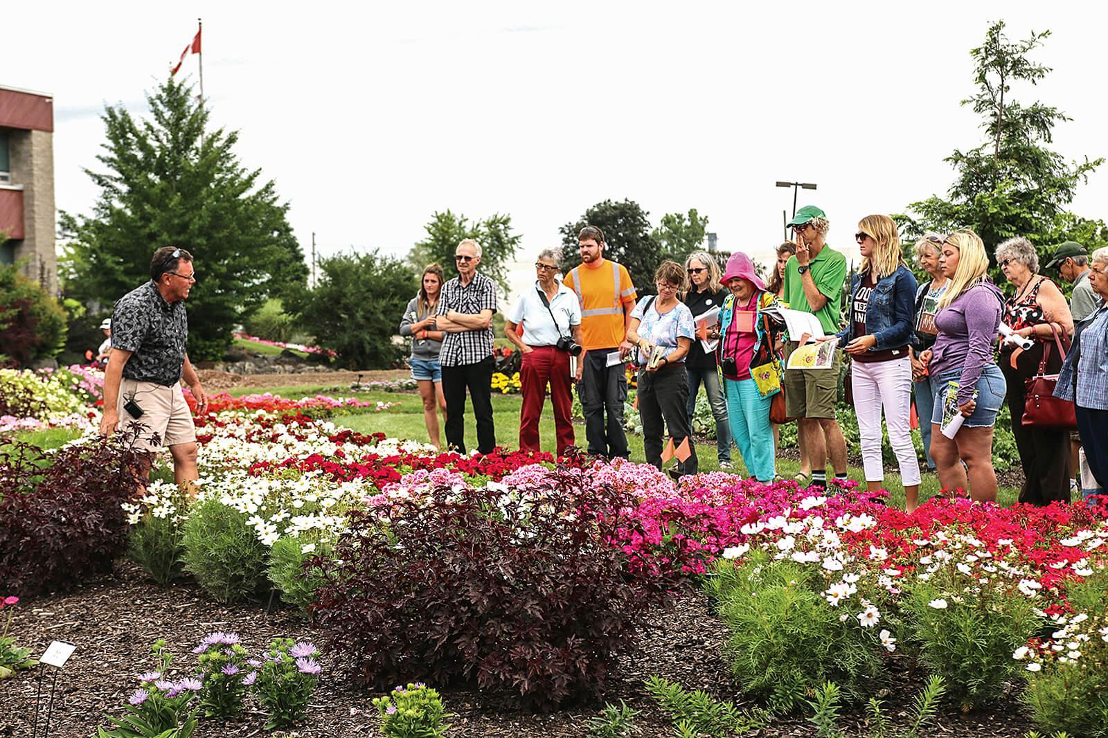 Trial garden manager Rodger Tschanz leads a tour of the Milton site.