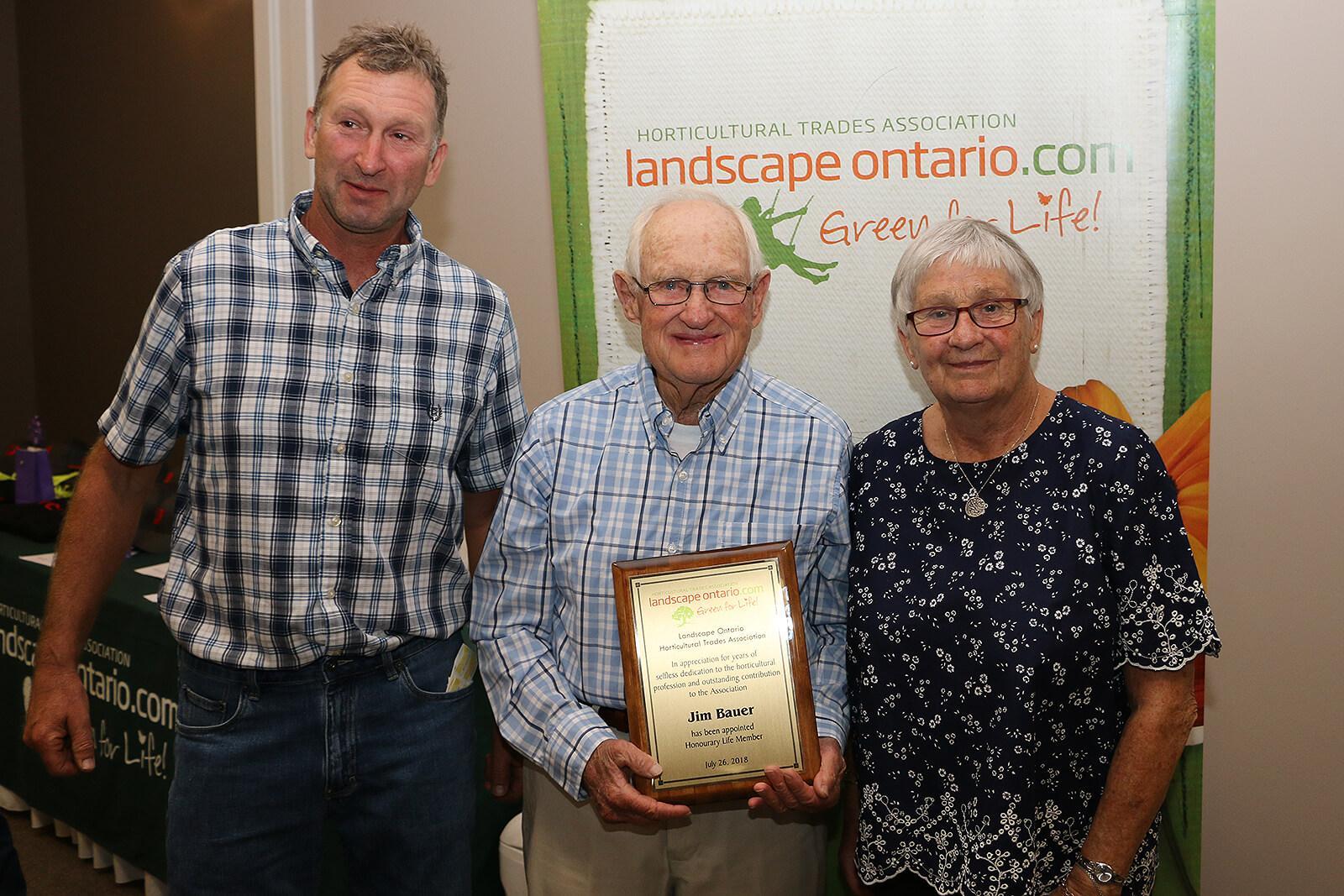 Jim Bauer, LO's newest Honorary Lifetime Member (centre), with son Bud and wife Anneke.