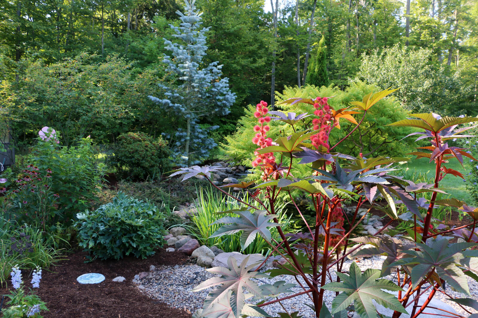 Gardens at the place of business are used to train employees and to showcase work to clients.