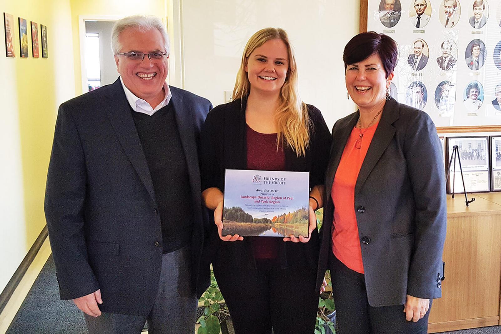 (L-R) Tony DiGiovanni and Cassandra Wiesner from Landscape Ontario accept an award from Deborah Martin-Downs, CAO of Credit Valley Conservation.