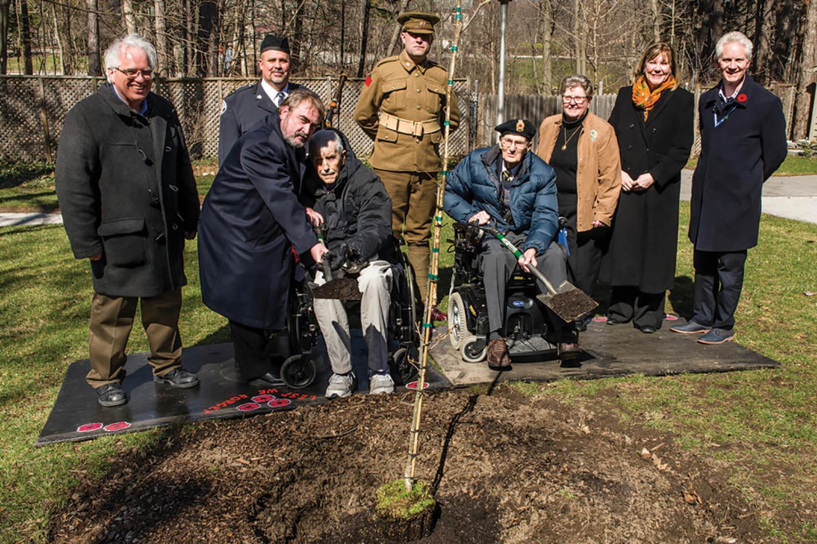 (Seated L-R) Second World War veterans Lawrence Tomkins and Michael Boyer were present for a special tree planting in Toronto.