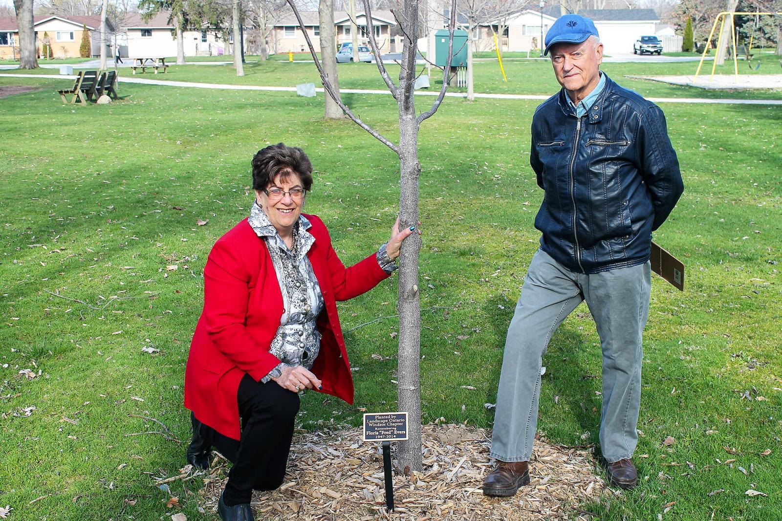 Ann Evers (left) and Windsor Chapter member, Lex Kraft attend a tree dedication ceremony to honour the late Fred Evers in Kingsville, Ont.