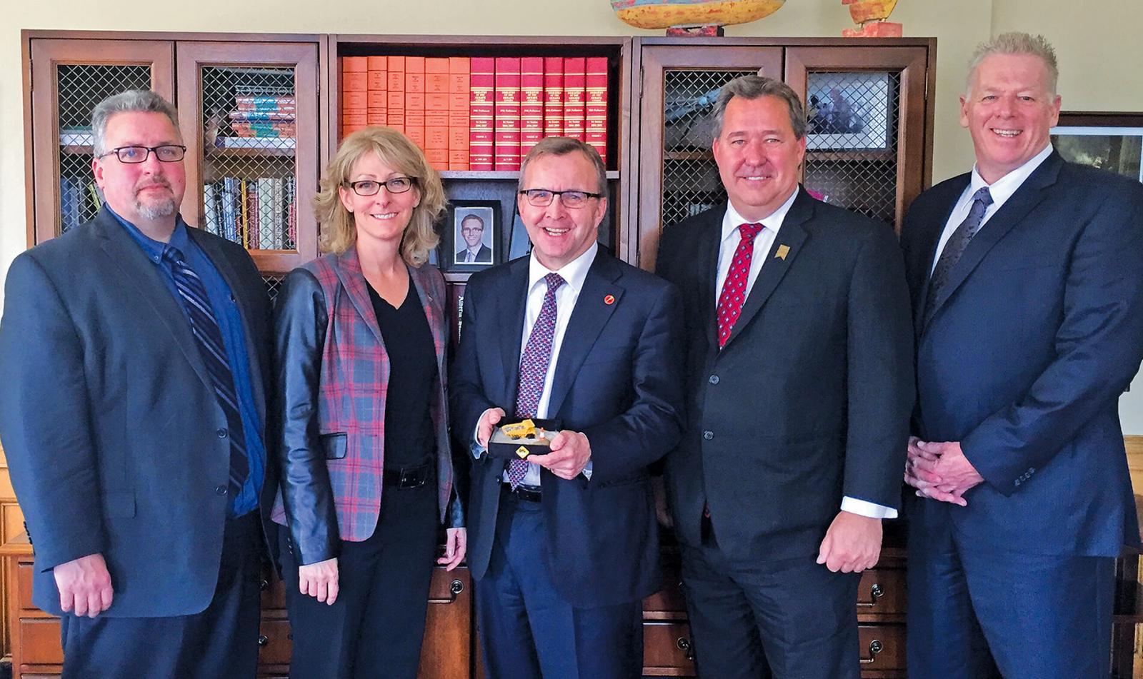 Senator Grant Mitchell (centre) accepting a DigSafe “MiniDig” after hosting the CCGA in the Senate during DigSafe month in April. (l-r) are Mike Sullivan, President, CCGA; Nathalie Moreau, Chair, Quebec CGA; Darwin Durnie (CPWA) and Ian Munro (ORCGA).