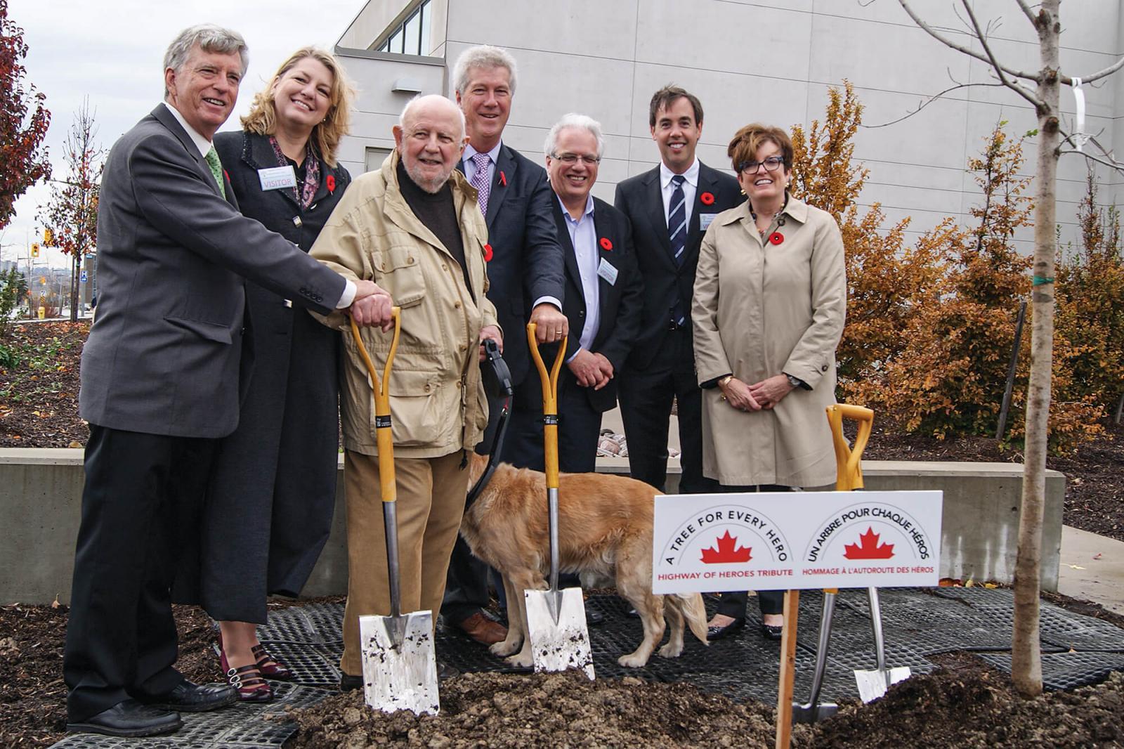 A ceremonial tree planting at the Coroner’s Office Complex in Toronto on Nov. 6 began the Highway of Heroes campaign to plant 117,000 trees along Hwy. 401. In photo, from left, are some of those who took part in the Toronto ceremony, Mark Cullen, chair of the Campaign; Paula Berketo, of the Ministry of Transportation; Ken Jewett, Maple Leaves Forever; Rob Keen, Forests Ontario; Tony DiGiovanni and Dave Braun, both representing Landscape Ontario, and Eleanor McMahon, Burlington MPP and Parliamentary Assistant to the Ministry of Natural Resources and Forestry.