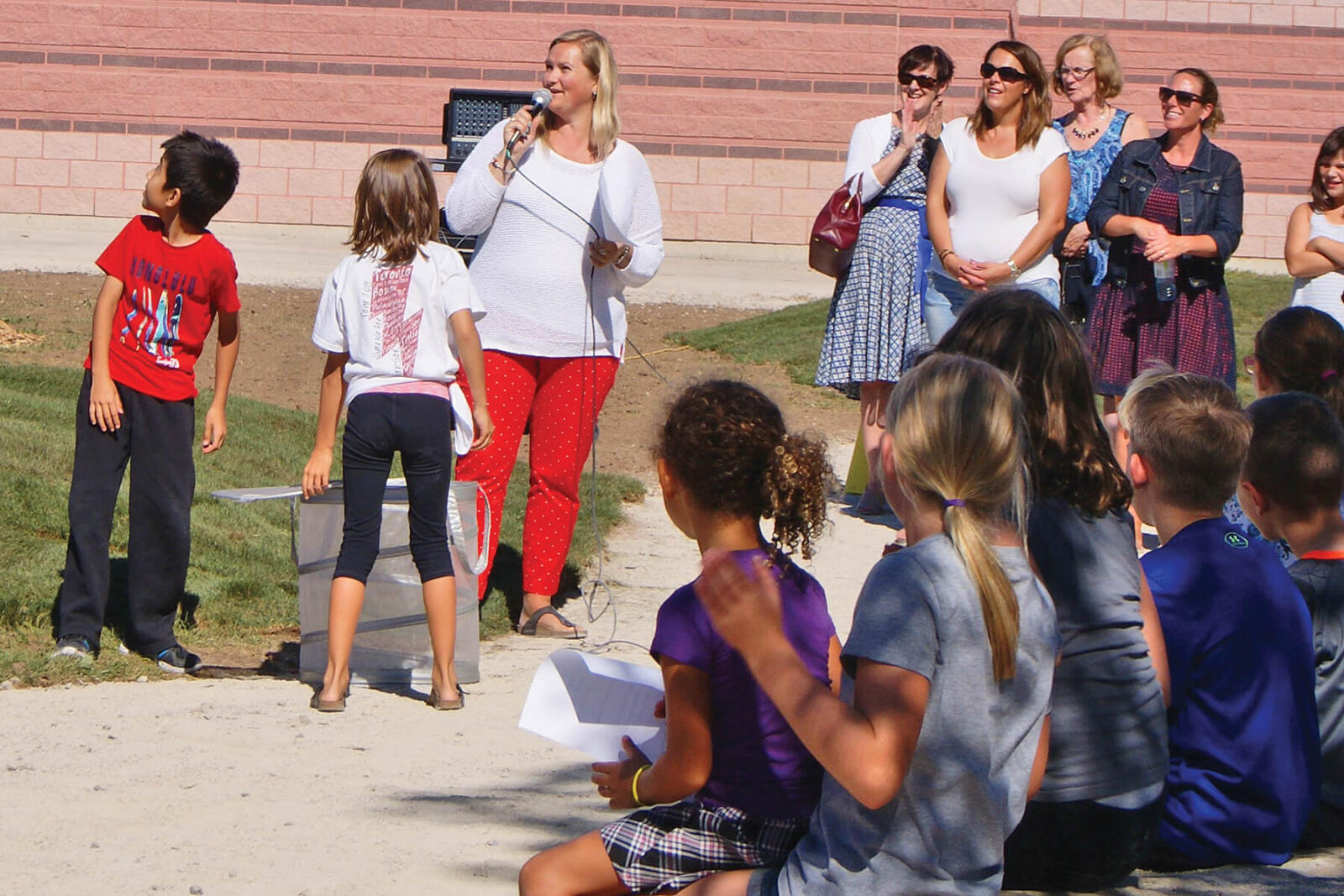 Students release a butterfly at Waterloo Chapter’s Greening Schoolyard project.