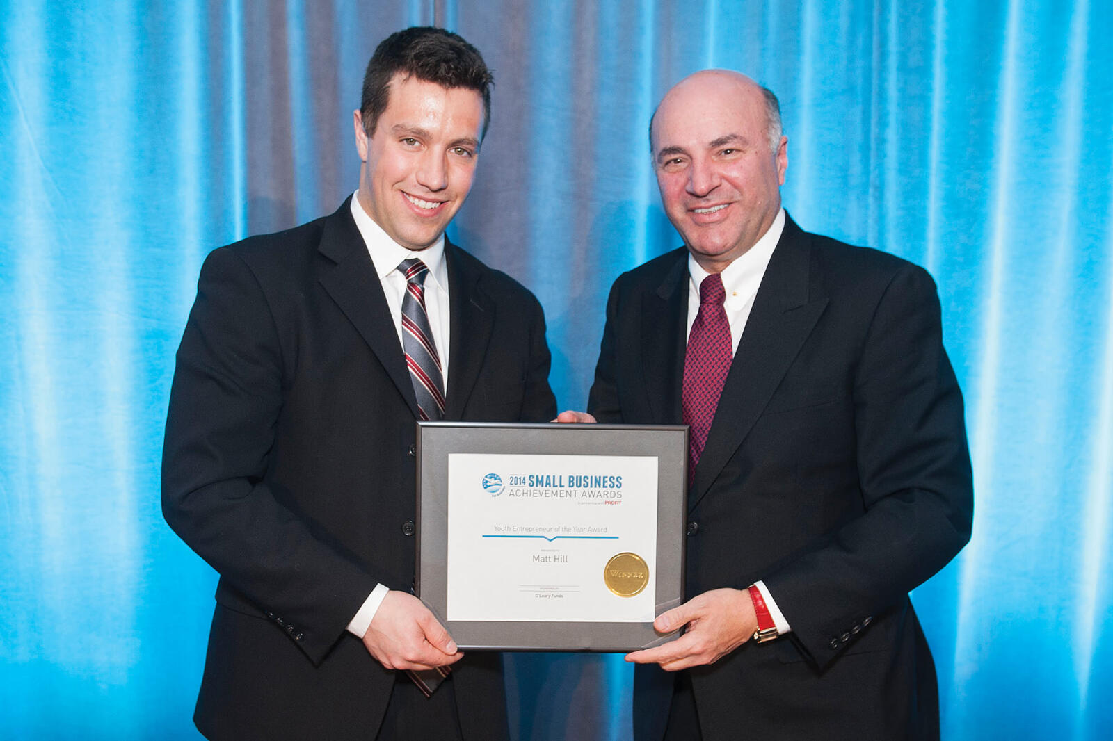 Matt Hill receives his award from Kevin O’Leary.