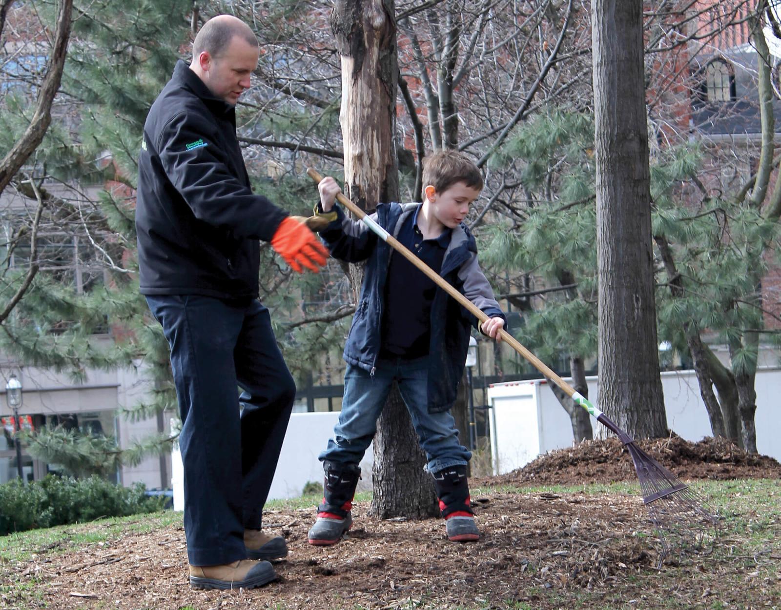 Kyle Tobin took time to teach his nephews about raking the right way.