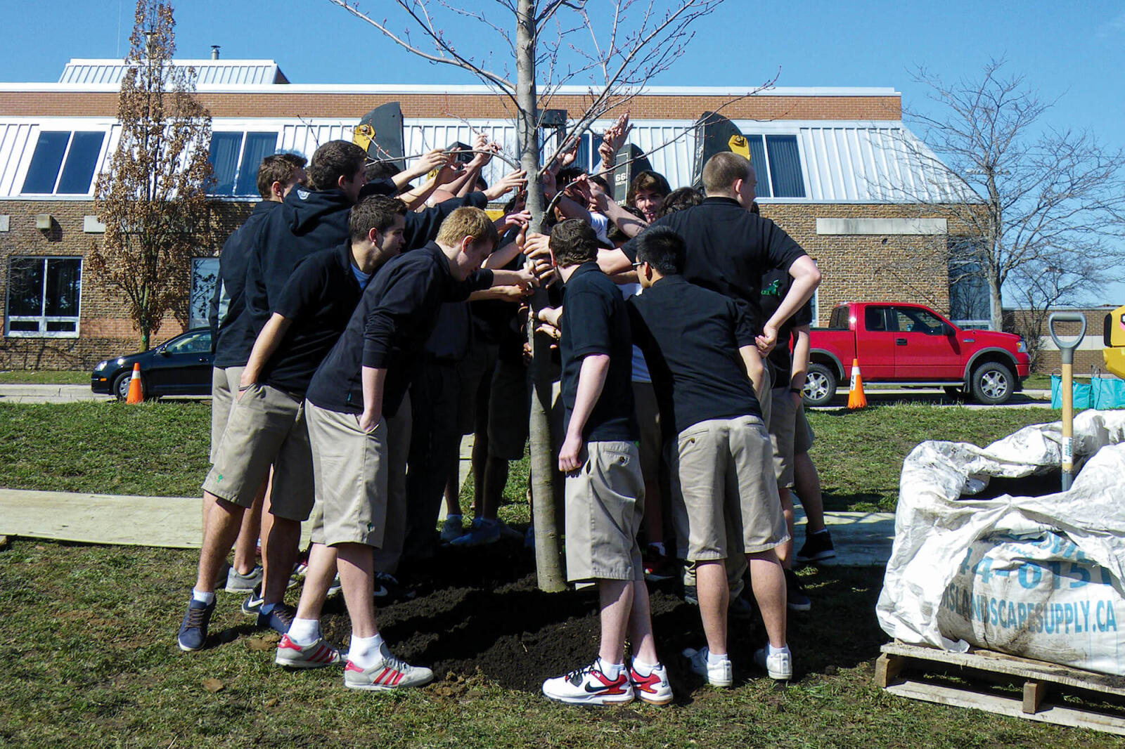 At the dedication ceremony in memory of Nick Brown, his soccer teammates said their goodbyes and pledged to care for the newly installed tree.