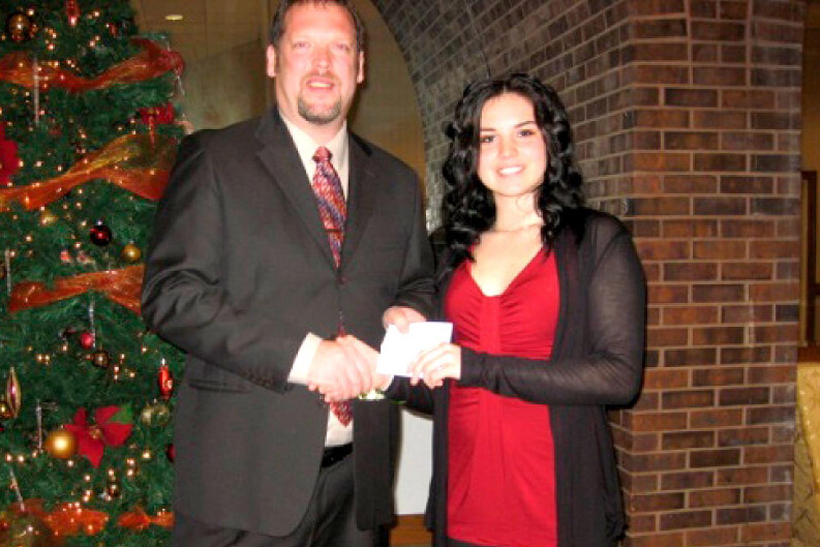David Wright presents the first Waterloo Chapter scholarship to recipient Brandy Suchostowsky.  