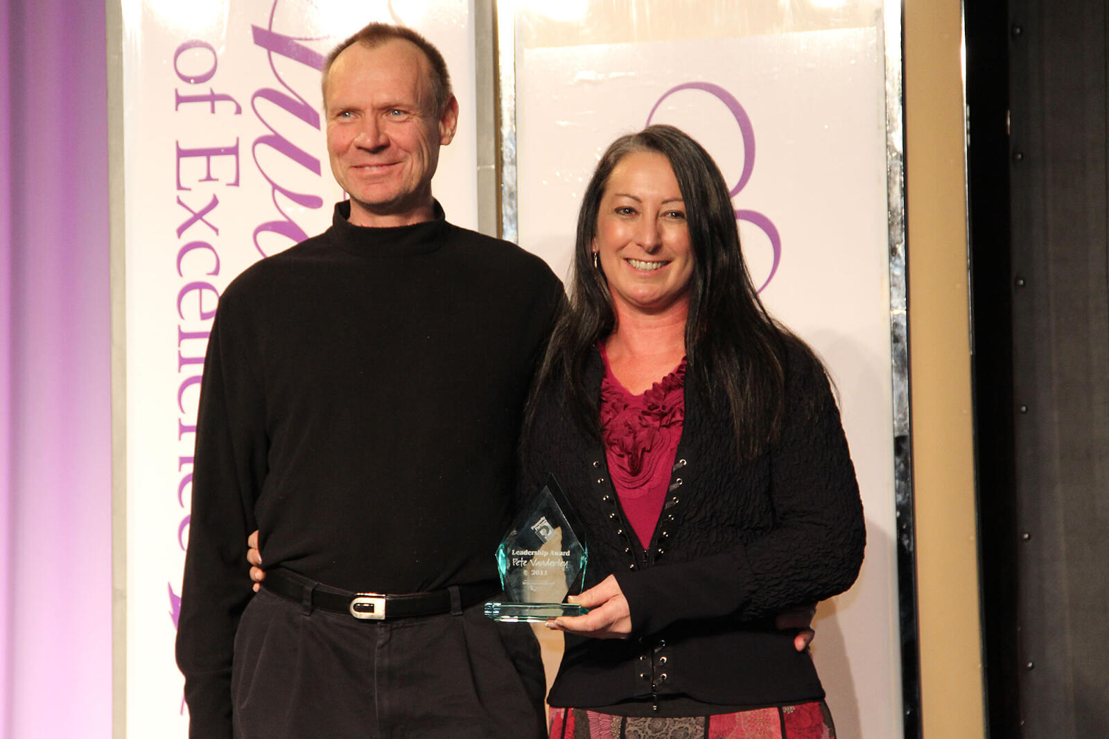 Pete Vanderley of Pete Vanderley’s Lawn Maintenance & Landscape Services proudly accepts this year’s Prosperity Partners Engagement Award from Jacki Hart.