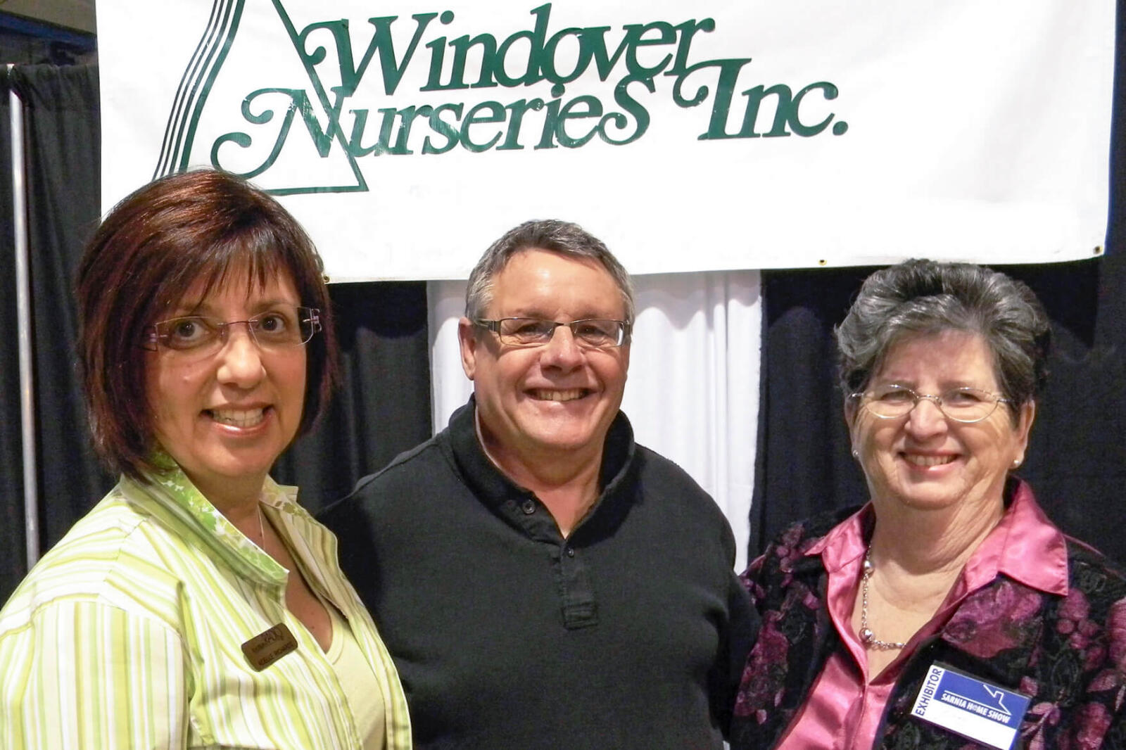 Adele Richards, left, and Jean Windover join Denis Flanagan at the Sarnia Home Show.