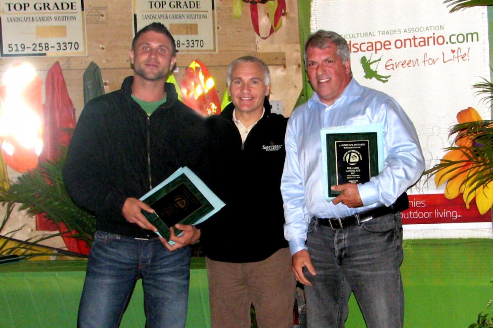 Accepting plaques at the Windsor Chapter Awards Night are from left, Christopher Keiser of Landscape Effects Group, Chapter president Nino Papa of Santerra Stonecraft, and Chris Power of Bellaire Landscape.