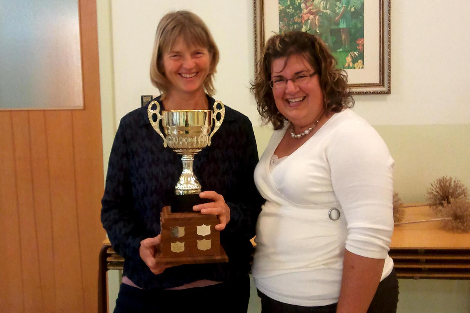 Bonita Glover of The Garden Network, left, accepts the Commercial Beautification Trophy from Lisa Smith of Lisa Purves Garden Design and Consultation, a member of Upper Canada Chapter board of directors.
