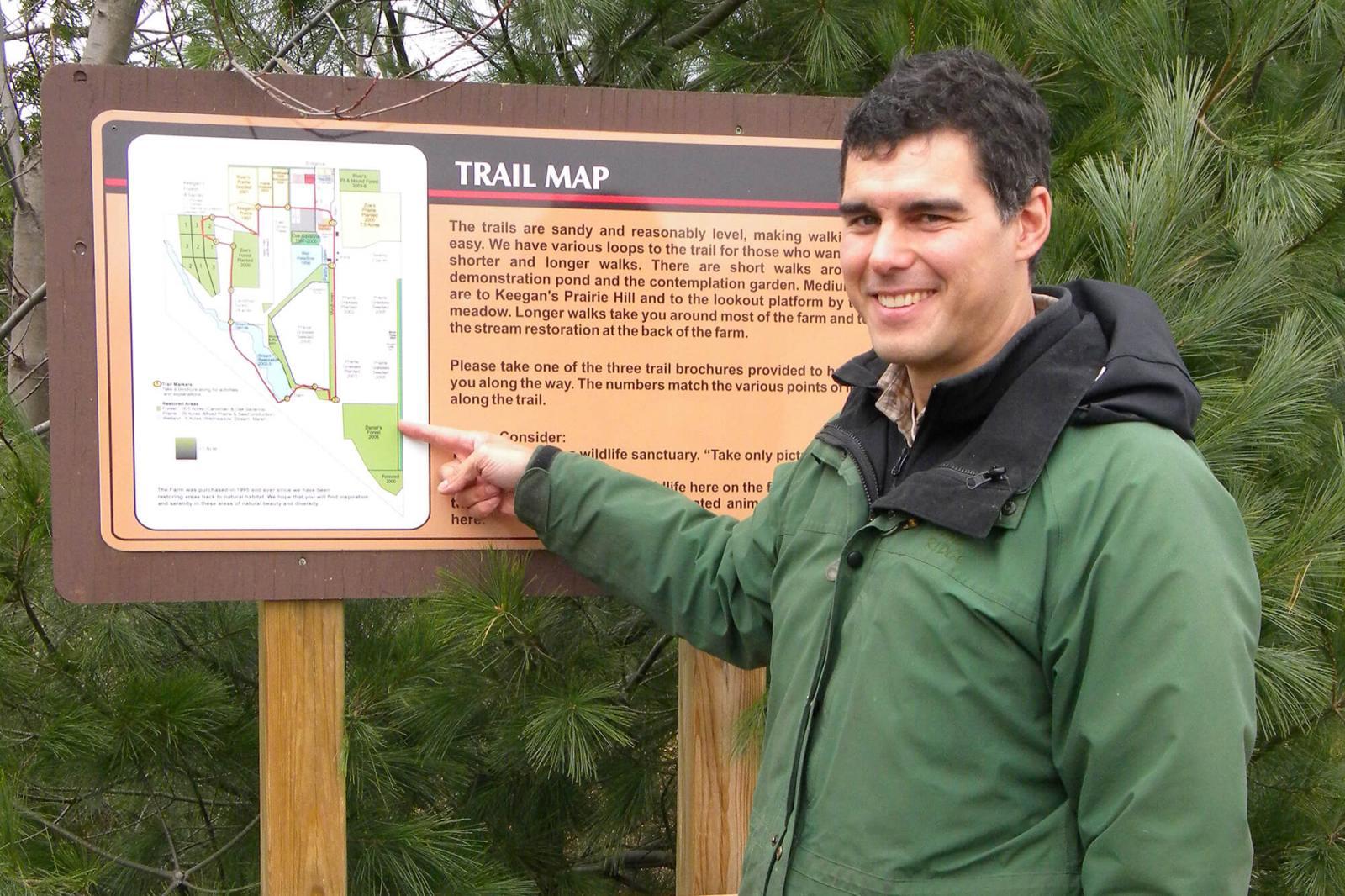 Visitors to the site may take their own tour, or one of the scheduled tour dates. Paul Morris shows map of the trails available on site.