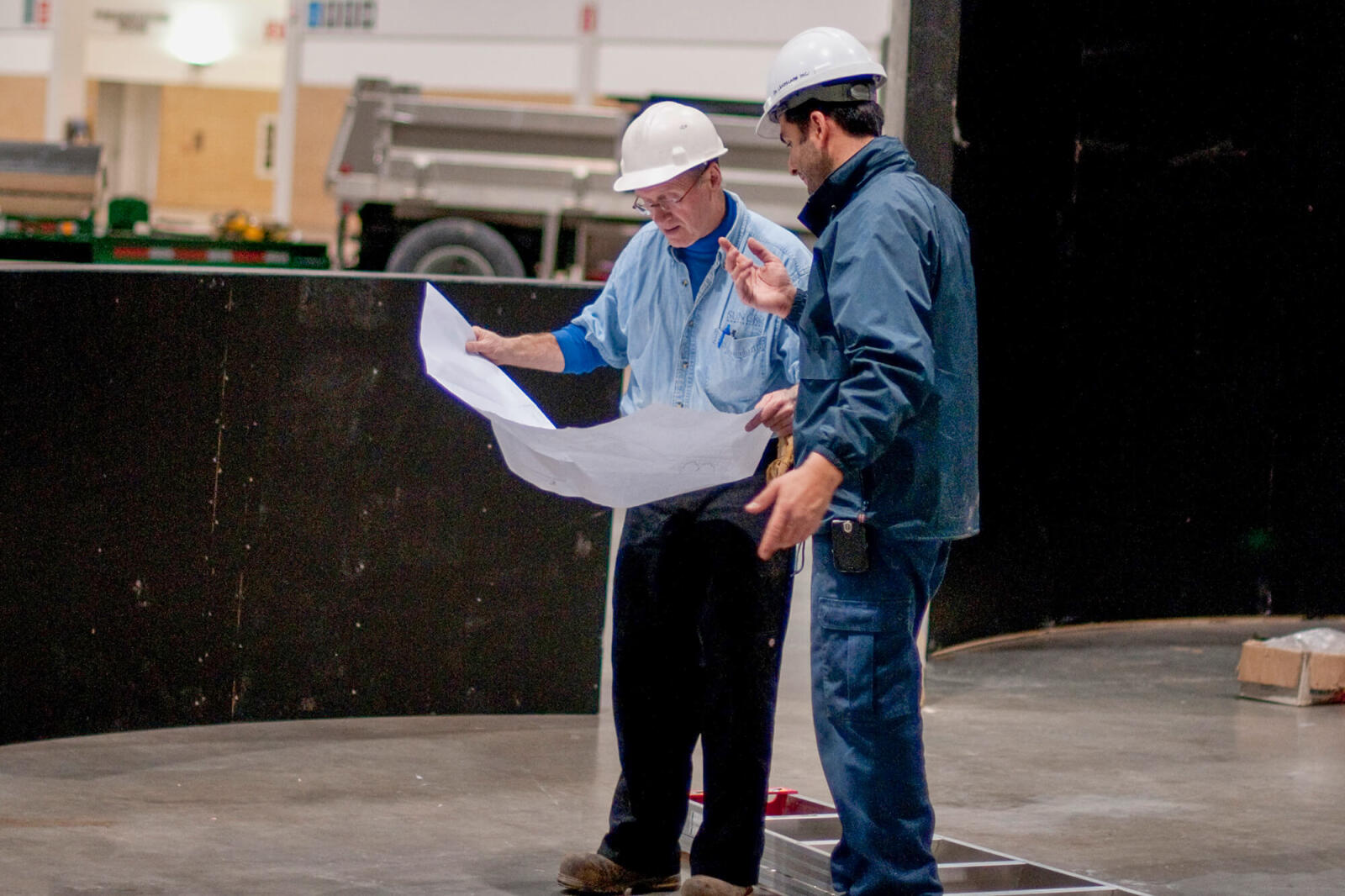 James Thompson, left, and Tony Lombardi go over the plans to create the waterfalls.