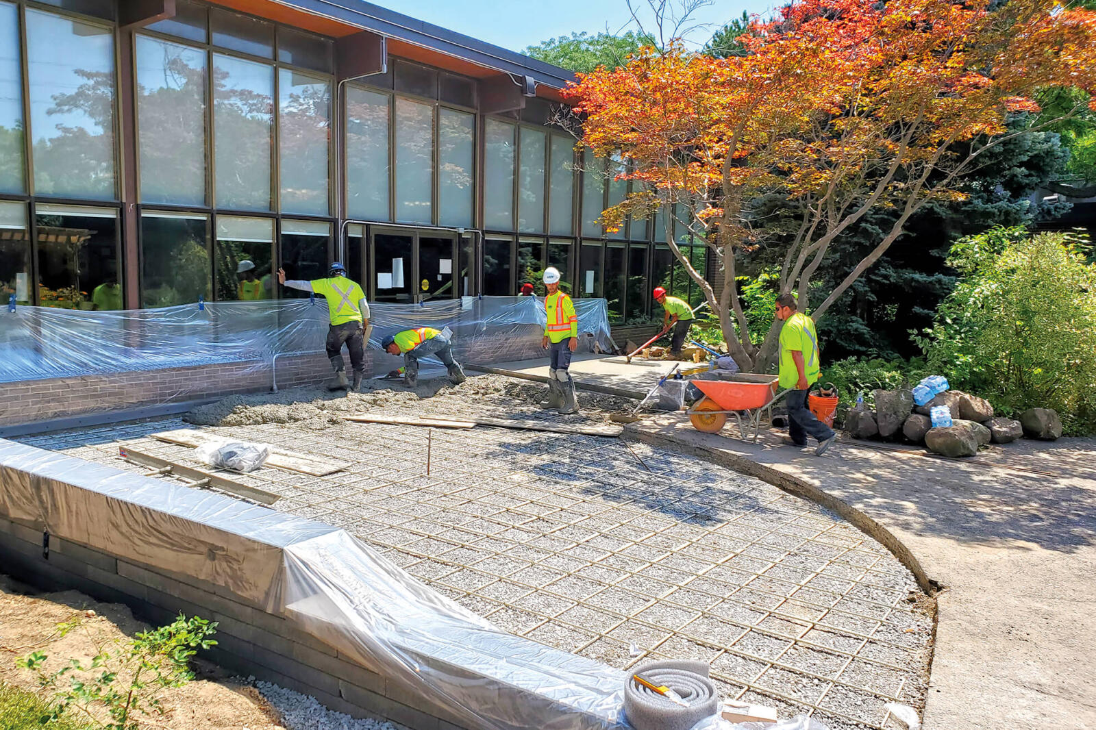 Volunteers work on installing the new outdoor space at Participation House.