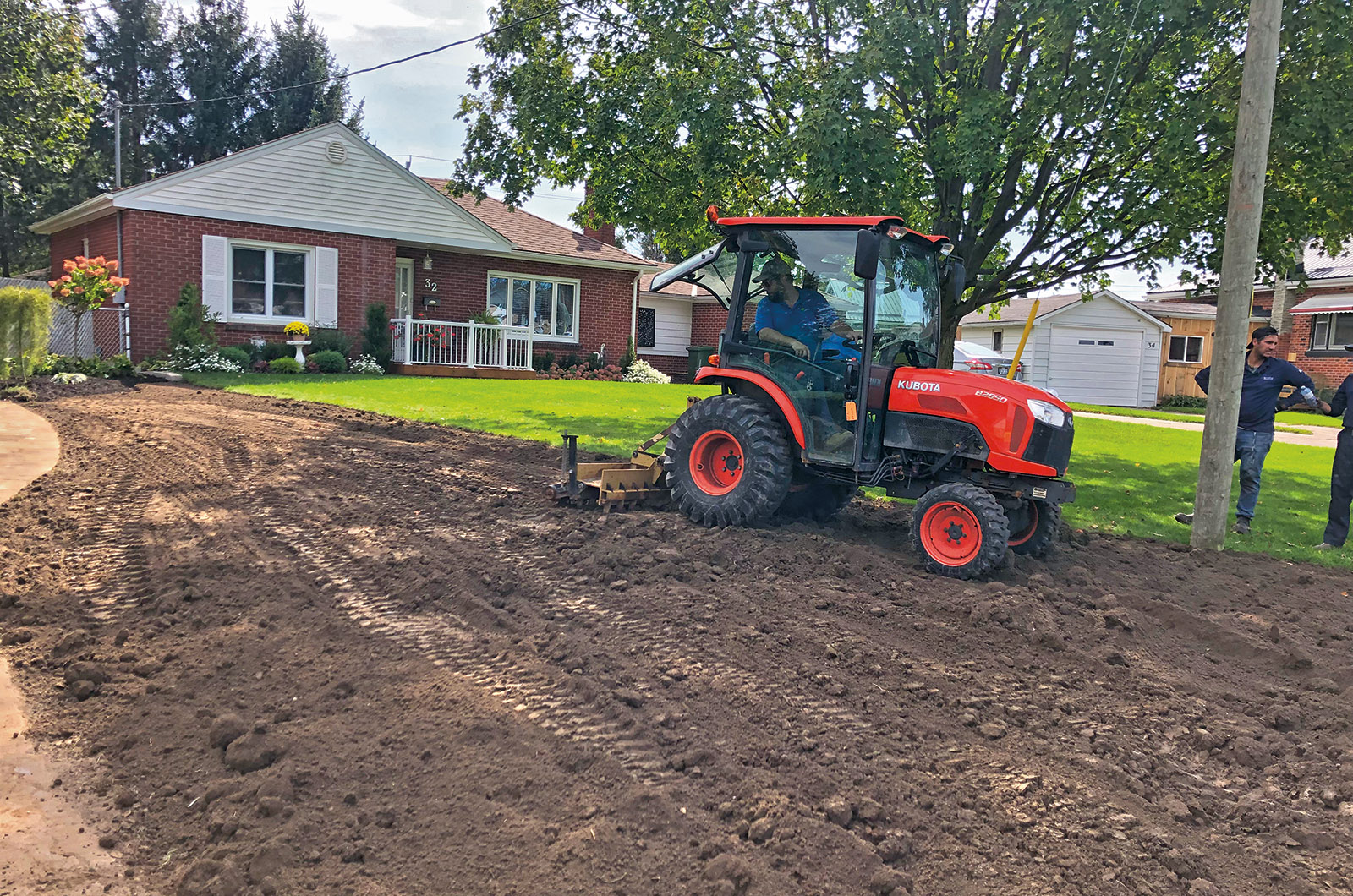 Teamwork shines as bright as the landscaping at London Chapter Garden Makeover