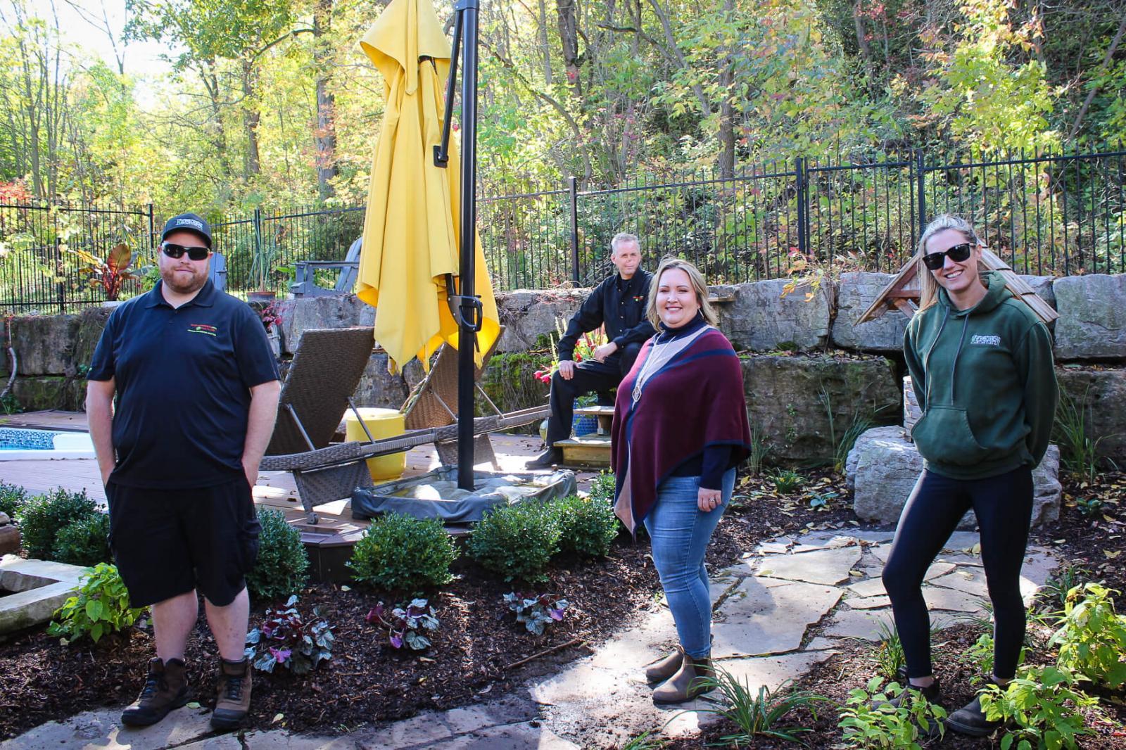 The Landscape Ontario Golden Horseshoe Chapter completed a garden makeover for Rebecca Davis (middle) in Grimby, Ont., this fall.