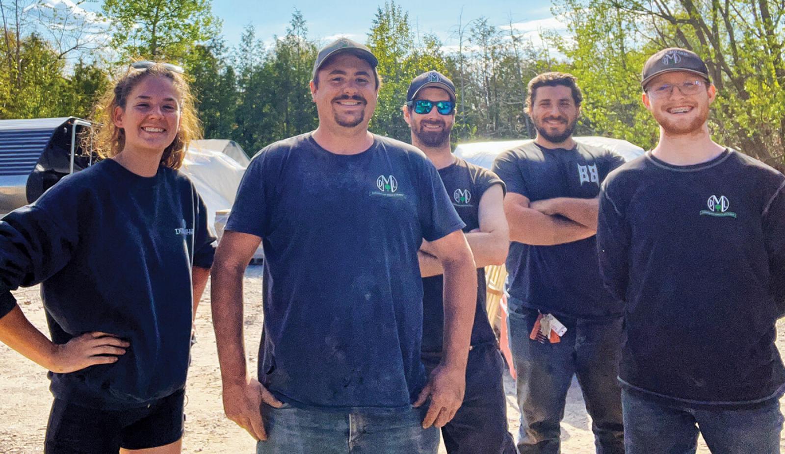 Keegan Stribbell (second from left) with fellow crew members at Dusty Miller Landscaping.